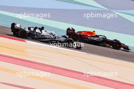 Pierre Gasly (FRA) AlphaTauri AT03 and Sergio Perez (MEX) Red Bull Racing RB18. 12.03.2022. Formula 1 Testing, Sakhir, Bahrain, Day Three.