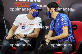 (L to R): Mick Schumacher (GER) Haas F1 Team with Esteban Ocon (FRA) Alpine F1 Team in the FIA Press Conference. 12.03.2022. Formula 1 Testing, Sakhir, Bahrain, Day Three.