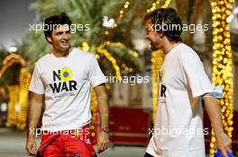 (L to R): Carlos Sainz Jr (ESP) Ferrari with Fernando Alonso (ESP) Alpine F1 Team. 09.03.2022. Formula 1 Testing, Sakhir, Bahrain.