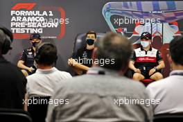 (L to R): Max Verstappen (NLD) Red Bull Racing; George Russell (GBR) Mercedes AMG F1; and Guanyu Zhou (CHN) Alfa Romeo F1 Team in the FIA Press Conference. 10.03.2022. Formula 1 Testing, Sakhir, Bahrain, Day One.