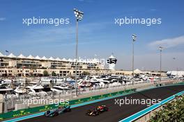 George Russell (GBR) Mercedes AMG F1 W13 and Sergio Perez (MEX) Red Bull Racing RB18. 18.11.2022. Formula 1 World Championship, Rd 22, Abu Dhabi Grand Prix, Yas Marina Circuit, Abu Dhabi, Practice Day.