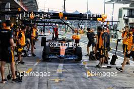 Lando Norris (GBR) McLaren MCL36 in the pits - pit box slippery patch. 18.11.2022. Formula 1 World Championship, Rd 22, Abu Dhabi Grand Prix, Yas Marina Circuit, Abu Dhabi, Practice Day.