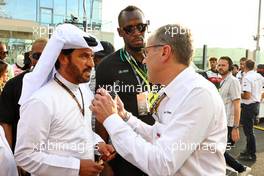 (L to R): Mohammed Bin Sulayem (UAE) FIA President with Usain Bolt (JAM) Former Athlete and Stefano Domenicali (ITA) Formula One President and CEO on the grid. 20.11.2022. Formula 1 World Championship, Rd 22, Abu Dhabi Grand Prix, Yas Marina Circuit, Abu Dhabi, Race Day.