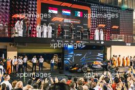 The podium (L to R): Charles Leclerc (MON) Ferrari, second; Max Verstappen (NLD) Red Bull Racing, race winner; Sergio Perez (MEX) Red Bull Racing, third; Olaf Janssen (ZAF) Red Bull Racing Trackside Infrastructure Group Leader. 20.11.2022. Formula 1 World Championship, Rd 22, Abu Dhabi Grand Prix, Yas Marina Circuit, Abu Dhabi, Race Day.