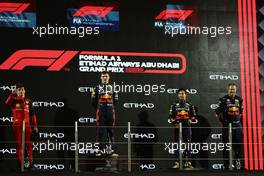 1st place Max Verstappen (NLD) Red Bull Racing, 2nd place Charles Leclerc (MON) Ferrari ad 3rd place Sergio Perez (MEX) Red Bull Racing RB18 and Olaf Janssen Red Bull Racing IT. 20.11.2022. Formula 1 World Championship, Rd 22, Abu Dhabi Grand Prix, Yas Marina Circuit, Abu Dhabi, Race Day.