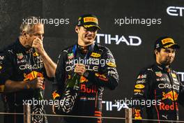 (L to R): Olaf Janssen (ZAF) Red Bull Racing Trackside Infrastructure Group Leader celebrates on the podium with race winner Max Verstappen (NLD) Red Bull Racing and third placed Sergio Perez (MEX) Red Bull Racing. 20.11.2022. Formula 1 World Championship, Rd 22, Abu Dhabi Grand Prix, Yas Marina Circuit, Abu Dhabi, Race Day.