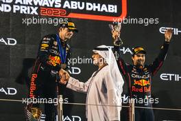 Race winner Max Verstappen (NLD) Red Bull Racing and third placed Sergio Perez (MEX) Red Bull Racing on the podium. 20.11.2022. Formula 1 World Championship, Rd 22, Abu Dhabi Grand Prix, Yas Marina Circuit, Abu Dhabi, Race Day.