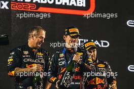 (L to R): Olaf Janssen (ZAF) Red Bull Racing Trackside Infrastructure Group Leader celebrates on the podium with race winner Max Verstappen (NLD) Red Bull Racing and third placed Sergio Perez (MEX) Red Bull Racing. 20.11.2022. Formula 1 World Championship, Rd 22, Abu Dhabi Grand Prix, Yas Marina Circuit, Abu Dhabi, Race Day.