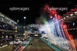 Race winner Max Verstappen (NLD) Red Bull Racing RB18 with fireworks at the end of the race. 20.11.2022. Formula 1 World Championship, Rd 22, Abu Dhabi Grand Prix, Yas Marina Circuit, Abu Dhabi, Race Day.