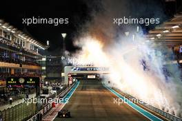Race winner Max Verstappen (NLD) Red Bull Racing RB18 with fireworks at the end of the race. 20.11.2022. Formula 1 World Championship, Rd 22, Abu Dhabi Grand Prix, Yas Marina Circuit, Abu Dhabi, Race Day.