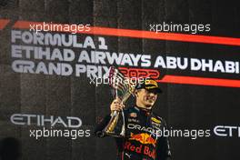 Race winner Max Verstappen (NLD) Red Bull Racing celebrates on the podium. 20.11.2022. Formula 1 World Championship, Rd 22, Abu Dhabi Grand Prix, Yas Marina Circuit, Abu Dhabi, Race Day.