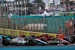 Lewis Hamilton (GBR) Mercedes AMG F1 W13 and Carlos Sainz Jr (ESP) Ferrari F1-75 battle for position. 20.11.2022. Formula 1 World Championship, Rd 22, Abu Dhabi Grand Prix, Yas Marina Circuit, Abu Dhabi, Race Day.