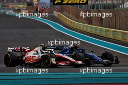 Mick Schumacher (GER) Haas VF-22 and Alexander Albon (THA) Williams Racing FW44 battle for position. 20.11.2022. Formula 1 World Championship, Rd 22, Abu Dhabi Grand Prix, Yas Marina Circuit, Abu Dhabi, Race Day.