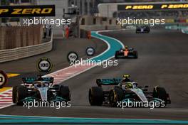 George Russell (GBR) Mercedes AMG F1 W13 and Lewis Hamilton (GBR) Mercedes AMG F1 W13 battle for position. 20.11.2022. Formula 1 World Championship, Rd 22, Abu Dhabi Grand Prix, Yas Marina Circuit, Abu Dhabi, Race Day.