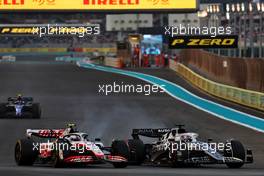 Mick Schumacher (GER) Haas VF-22 and Pierre Gasly (FRA) AlphaTauri AT03 battle for position. 20.11.2022. Formula 1 World Championship, Rd 22, Abu Dhabi Grand Prix, Yas Marina Circuit, Abu Dhabi, Race Day.