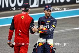 (L to R): Charles Leclerc (MON) Ferrari and Sergio Perez (MEX) Red Bull Racing in qualifying parc ferme. 19.11.2022. Formula 1 World Championship, Rd 22, Abu Dhabi Grand Prix, Yas Marina Circuit, Abu Dhabi, Qualifying Day.