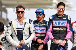 (L to R): Fernando Alonso (ESP) Alpine F1 Team; Esteban Ocon (FRA) Alpine F1 Team; and Mick Schumacher (GER) Haas F1 Team, at the end of year drivers' photograph. 20.11.2022. Formula 1 World Championship, Rd 22, Abu Dhabi Grand Prix, Yas Marina Circuit, Abu Dhabi, Race Day.