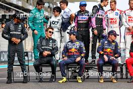 (L to R): Lewis Hamilton (GBR) Mercedes AMG F1; George Russell (GBR) Mercedes AMG F1; and Sergio Perez (MEX) Red Bull Racing at the end of year drivers' photograph. 20.11.2022. Formula 1 World Championship, Rd 22, Abu Dhabi Grand Prix, Yas Marina Circuit, Abu Dhabi, Race Day.