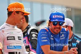 (L to R): Lando Norris (GBR) McLaren and Fernando Alonso (ESP) Alpine F1 Team on the drivers parade. 20.11.2022. Formula 1 World Championship, Rd 22, Abu Dhabi Grand Prix, Yas Marina Circuit, Abu Dhabi, Race Day.