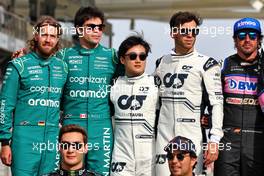 (L to R): Sebastian Vettel (GER) Aston Martin F1 Team; Lance Stroll (CDN) Aston Martin F1 Team; Yuki Tsunoda (JPN) AlphaTauri; Pierre Gasly (FRA) AlphaTauri; and Fernando Alonso (ESP) Alpine F1 Team, at the end of year drivers' photograph. 20.11.2022. Formula 1 World Championship, Rd 22, Abu Dhabi Grand Prix, Yas Marina Circuit, Abu Dhabi, Race Day.