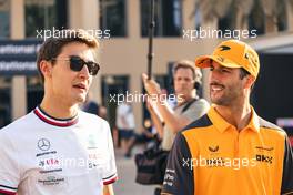 (L to R): George Russell (GBR) Mercedes AMG F1 with Daniel Ricciardo (AUS) McLaren. 17.11.2022. Formula 1 World Championship, Rd 22, Abu Dhabi Grand Prix, Yas Marina Circuit, Abu Dhabi, Preparation Day.