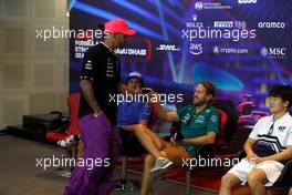 Lewis Hamilton (GBR) Mercedes AMG F1 with Sebastian Vettel (GER) Aston Martin F1 Team in the FIA Press Conference. 17.11.2022. Formula 1 World Championship, Rd 22, Abu Dhabi Grand Prix, Yas Marina Circuit, Abu Dhabi, Preparation Day.