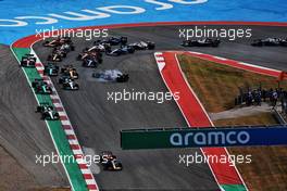 Max Verstappen (NLD) Red Bull Racing RB18 leads at the start of the race as Carlos Sainz Jr (ESP) Ferrari F1-75 is hit out of the race by George Russell (GBR) Mercedes AMG F1 W13. 23.10.2022. Formula 1 World Championship, Rd 19, United States Grand Prix, Austin, Texas, USA, Race Day.