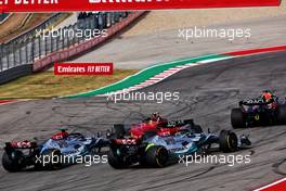 Carlos Sainz Jr (ESP) Ferrari F1-75 is hit by George Russell (GBR) Mercedes AMG F1 W13 at the start of the race. 23.10.2022. Formula 1 World Championship, Rd 19, United States Grand Prix, Austin, Texas, USA, Race Day.