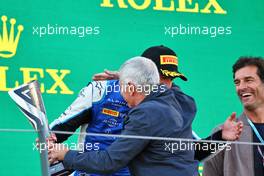 Jack Doohan (AUS) Virtuosi Racing is presented his third placed trophy on the podium by his father Jack Doohan (AUS) Alpine Academy Driver. 09.07.2022. FIA Formula 2 Championship, Rd 8, Spielberg, Austria, Saturday.