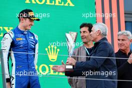 Jack Doohan (AUS) Virtuosi Racing is presented his third placed trophy on the podium by his father Jack Doohan (AUS) Alpine Academy Driver. 09.07.2022. FIA Formula 2 Championship, Rd 8, Spielberg, Austria, Saturday.
