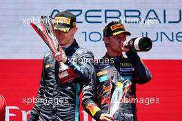 (L to R): Logan Sargeant (USA) Carlin celebrates his second position on the podium with race winner Dennis Hauger (DEN) PREMA Racing. 12.06.2022. FIA Formula 2 Championship, Rd 6, Baku, Azerbaijan, Sunday.