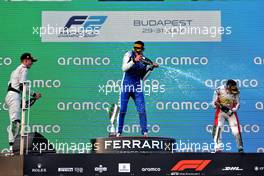 The podium (L to R): Juri Vips (EST) Hitech, second; Jack Doohan (AUS) Virtuosi Racing, race winner; Enzo Fittipaldi (BRA) Charouz Racing System, third. 30.07.2022. FIA Formula 2 Championship, Rd 10, Budapest, Hungary, Sprint Race, Saturday.