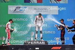 The podium (L to R): Enzo Fittipaldi (BRA) Charouz Racing System, second; Theo Pourchaire (FRA) ART, race winner; Ayumu Iwasa (JPN) Dams, third. 31.07.2022. FIA Formula 2 Championship, Rd 10, Budapest, Hungary, Feature Race, Sunday.