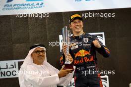 Race winner Liam Lawson (NZL) Carlin on the podium. 19.11.2022. Formula 2 Championship, Rd 14, Yas Marina Circuit, Abu Dhabi, UAE, Sprint Race, Saturday.