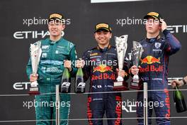 The podium (L to R): Felipe Drugovich (BRA) MP Motorsport, second; Ayumu Iwasa (JPN) Dams, race winner; Liam Lawson (NZL) Carlin, third. 20.11.2022. Formula 2 Championship, Rd 14, Yas Marina Circuit, Abu Dhabi, UAE, Feature Race, Sunday.