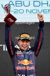Race winner Ayumu Iwasa (JPN) Dams celebrates on the podium. 20.11.2022. Formula 2 Championship, Rd 14, Yas Marina Circuit, Abu Dhabi, UAE, Feature Race, Sunday.