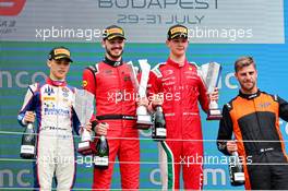 The podium (L to R): Zane Maloney (BRB) Trident, second; Alexander Smolyar (RUS) MP Motorsport, race winner; Oliver Bearman (GBR) Prema Racing, third. 31.07.2022. FIA Formula 3 Championship, Rd 6, Feature Race, Budapest, Hungary, Sunday.