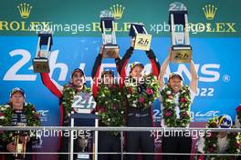 Race winners Sebastien Buemi (SUI) / Brendon Hartley (NZL) / Ryo Hirakawa (JPN) / Kazuki Nakajima (JPN) #08 Toyota Racing, celebrate on the podium. 12.06.2022. FIA World Endurance Championship, Round 3, Le Mans 24 Hours Race, Le Mans, France, Sunday