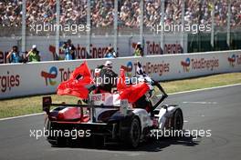 Race winners Sebastien Buemi (SUI) / Brendon Hartley (NZL) / Ryo Hirakawa (JPN) #08 Toyota Racing, Toyota GR010, Hybrid celebrate at the end of the race. 12.06.2022. FIA World Endurance Championship, Round 3, Le Mans 24 Hours Race, Le Mans, France, Sunday