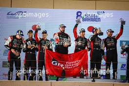 The podium (L to R): Brendon Hartley (NZL), Sebastien Buemi (SUI), Ryo Hirakawa (JPN) #08 Toyota Gazoo Racing, second; Kamui Kobayashi (JPN), Jose Maria Lopez (ARG), Mike Conway (GBR) #07 Toyota Gazoo Racing, winners. 12.11.2022. FIA World Endurance Championship, Round 6, Eight Hours of Bahrain, Sakhir, Bahrain, Saturday.