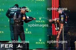 (L to R): Second placed Lewis Hamilton (GBR) Mercedes AMG F1 celebrates on the podium with race winner Max Verstappen (NLD) Red Bull Racing. 02.04.2023. Formula 1 World Championship, Rd 3, Australian Grand Prix, Albert Park, Melbourne, Australia, Race Day.