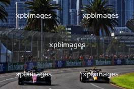 (L to R): Zhou Guanyu (CHN) Alfa Romeo F1 Team C43 and Sergio Perez (MEX) Red Bull Racing RB19. 02.04.2023. Formula 1 World Championship, Rd 3, Australian Grand Prix, Albert Park, Melbourne, Australia, Race Day.