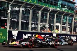 Max Verstappen (NLD) Red Bull Racing RB19 and Lewis Hamilton (GBR) Mercedes AMG F1 W14 at the second restart of the race. 02.04.2023. Formula 1 World Championship, Rd 3, Australian Grand Prix, Albert Park, Melbourne, Australia, Race Day.