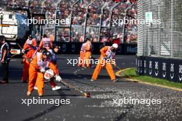 Marshals sweep clear the gravel left by Alexander Albon (THA) Williams Racing that brought out the red flag. 02.04.2023. Formula 1 World Championship, Rd 3, Australian Grand Prix, Albert Park, Melbourne, Australia, Race Day.