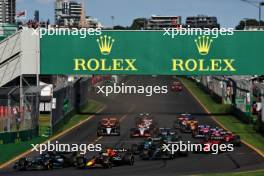 George Russell (GBR) Mercedes AMG F1 W14 leads Max Verstappen (NLD) Red Bull Racing RB19 at the start of the race. 02.04.2023. Formula 1 World Championship, Rd 3, Australian Grand Prix, Albert Park, Melbourne, Australia, Race Day.