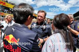 Christian Horner (GBR) Red Bull Racing Team Principal with Chalerm Yoovidhya (THA) Red Bull Racing Co-Owner and his wife on the grid. 02.07.2023. Formula 1 World Championship, Rd 10, Austrian Grand Prix, Spielberg, Austria, Race Day.