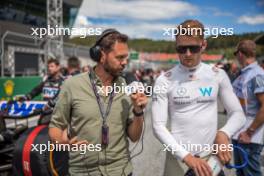 Logan Sargeant (USA) Williams Racing with Chris Medland (GBR) Journalist on the grid. 02.07.2023. Formula 1 World Championship, Rd 10, Austrian Grand Prix, Spielberg, Austria, Race Day.