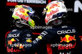 (L to R): Sergio Perez (MEX) Red Bull Racing with race winner and team mate Max Verstappen (NLD) Red Bull Racing in parc ferme. 02.07.2023. Formula 1 World Championship, Rd 10, Austrian Grand Prix, Spielberg, Austria, Race Day.