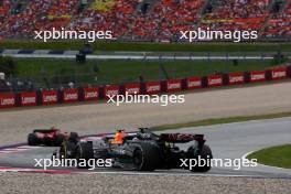 Sergio Perez (MEX) Red Bull Racing RB19 and Lewis Hamilton (GBR) Mercedes AMG F1 W14 battle for position. 02.07.2023. Formula 1 World Championship, Rd 10, Austrian Grand Prix, Spielberg, Austria, Race Day.