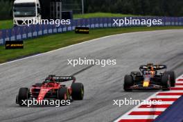 Charles Leclerc (MON) Ferrari SF-23 leads Max Verstappen (NLD) Red Bull Racing RB19. 02.07.2023. Formula 1 World Championship, Rd 10, Austrian Grand Prix, Spielberg, Austria, Race Day.